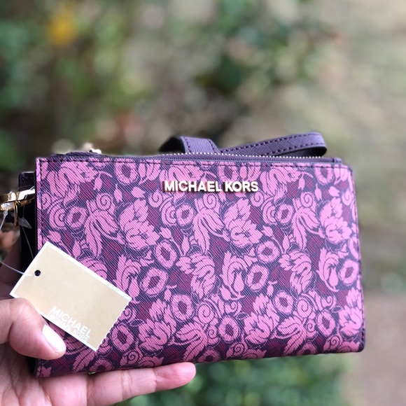 Michael Kors Handbags - Michael kors floral wristlet/ phone case Damson